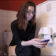 A brunette, Canadian girl wearing glasses takes a piss and a shit while sitting on a toilet and playing with her cell phone. Subtle, but audible pooping sounds. She wipes her ass when finished. Presented in 720P HD. About 6 minutes.